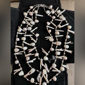 Custom Baroque pearl 3-tiered necklace. Clasp of silver connected by beads.